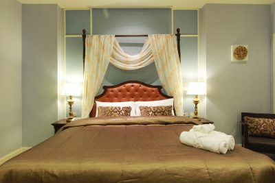 The draped bed of an Exclusive Deluxe Room