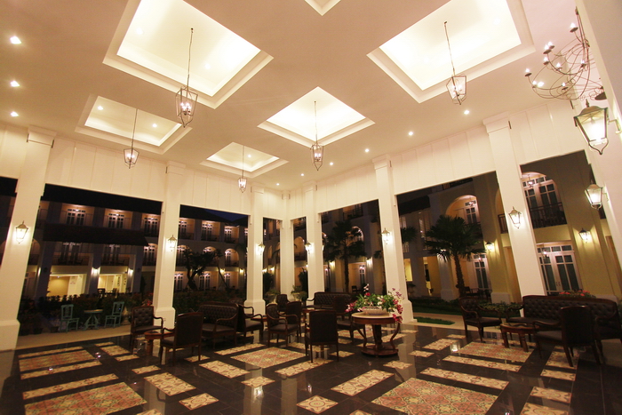 The colonnaded lobby with its patterned tile floor
